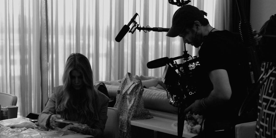 a black and white image of jessica simpson being filmed by a camera