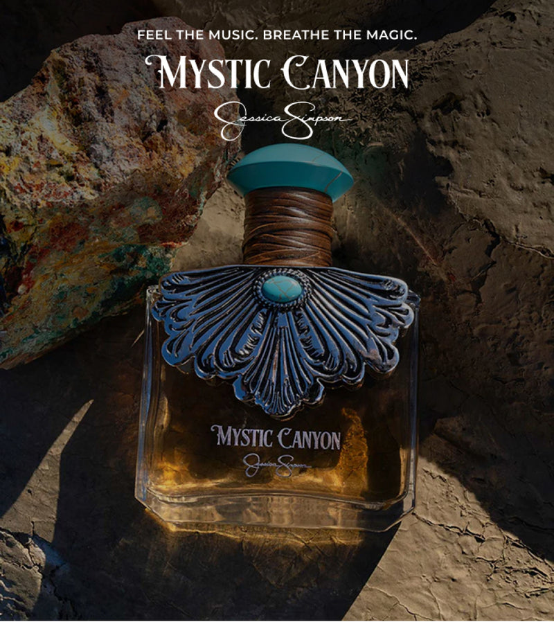 Perfume bottle labeled 'Mystic Canyon' against a rocky background