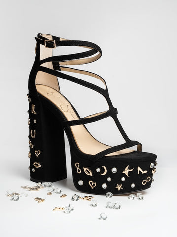 Black high-heeled sandals with gold embellishments on a white background